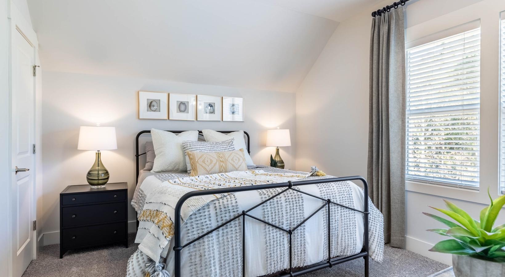 Beautiful bedrooms to fit every need a bedroom with a bed and lamps