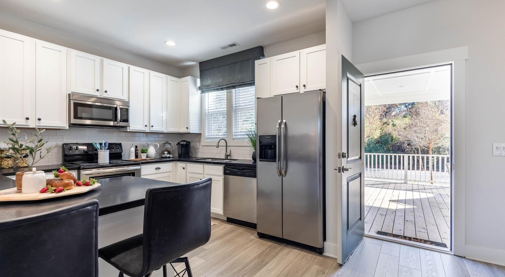 Settle into comfort at Cadia Myrtle Landing a kitchen with a large island